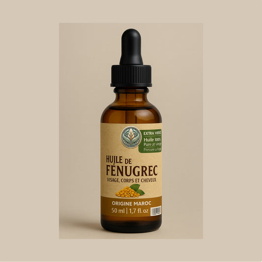 Flacon d’huile de fenugrec et sésame 100 % naturelle pressée à froid, soin capillaire et raffermissant fabriqué artisanalement au Maroc.